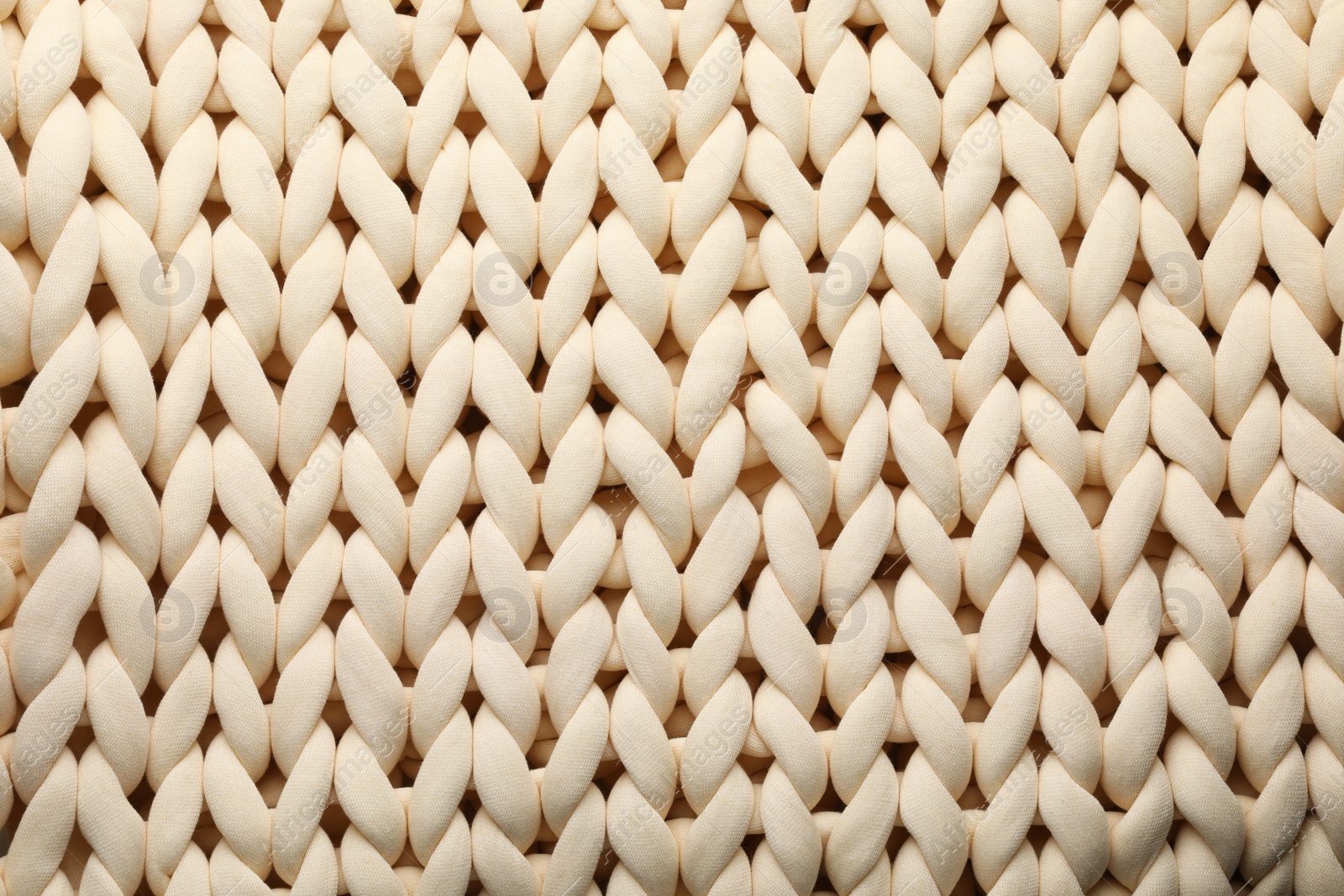 Photo of Chunky knit blankets as background, top view