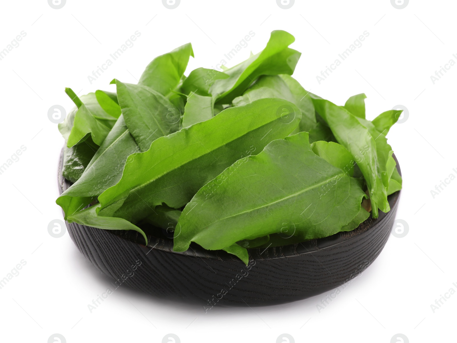 Photo of Fresh green sorrel leaves in wooden bowl isolated on white