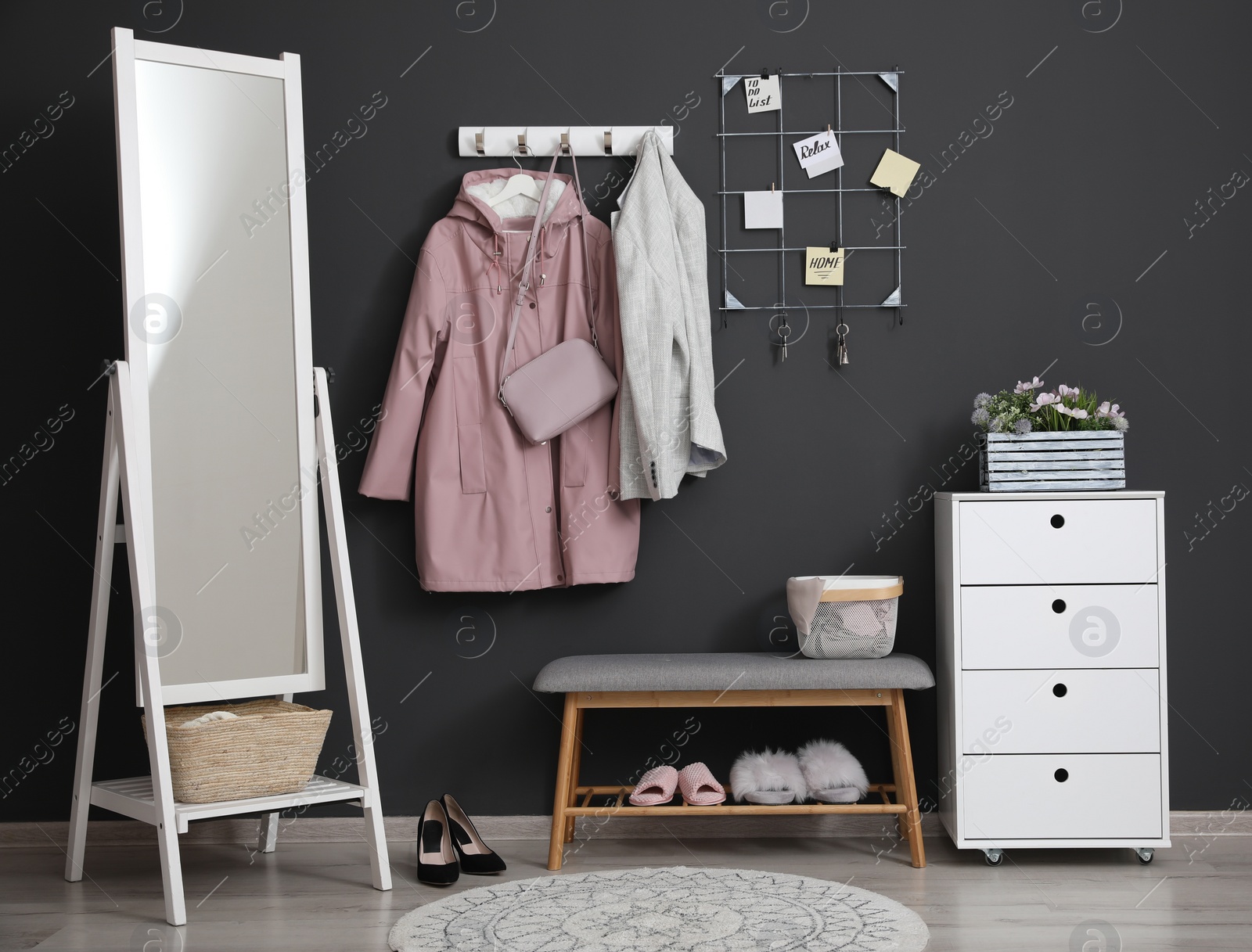 Photo of Hallway interior with stylish furniture, clothes and accessories
