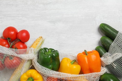 Fresh vegetables on light grey background, flat lay. Space for text