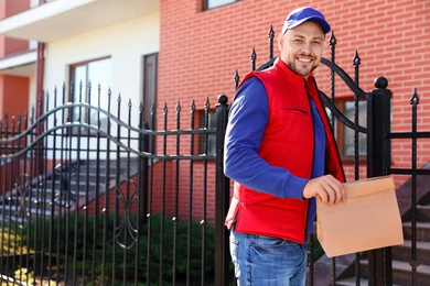 Male courier delivering food in city on sunny day