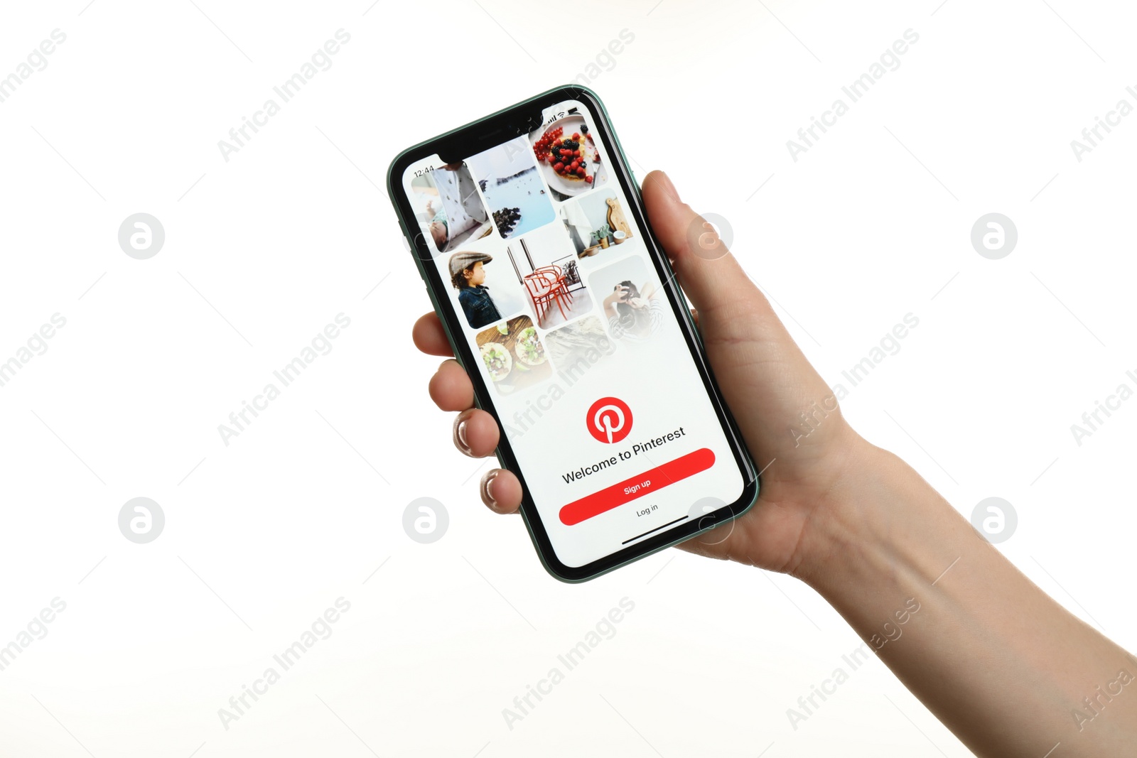 Photo of MYKOLAIV, UKRAINE - JULY 9, 2020: Woman holding  iPhone X with Pinterest app on white background, closeup