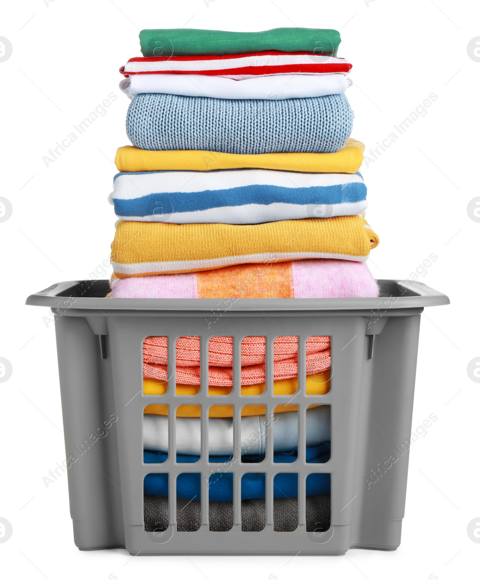 Photo of Plastic laundry basket with clean clothes isolated on white