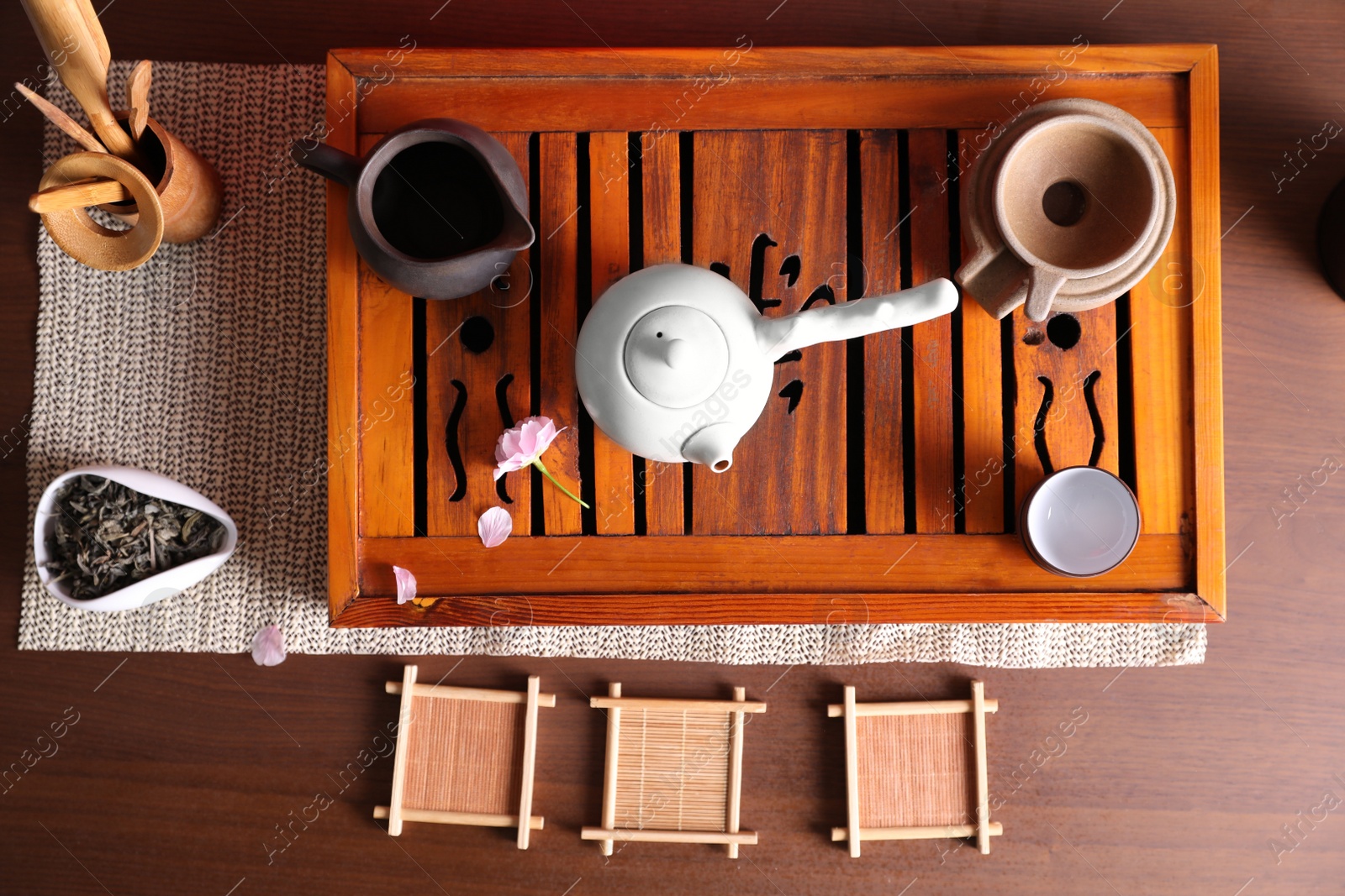 Photo of Beautiful set for traditional tea ceremony on wooden table, flat lay