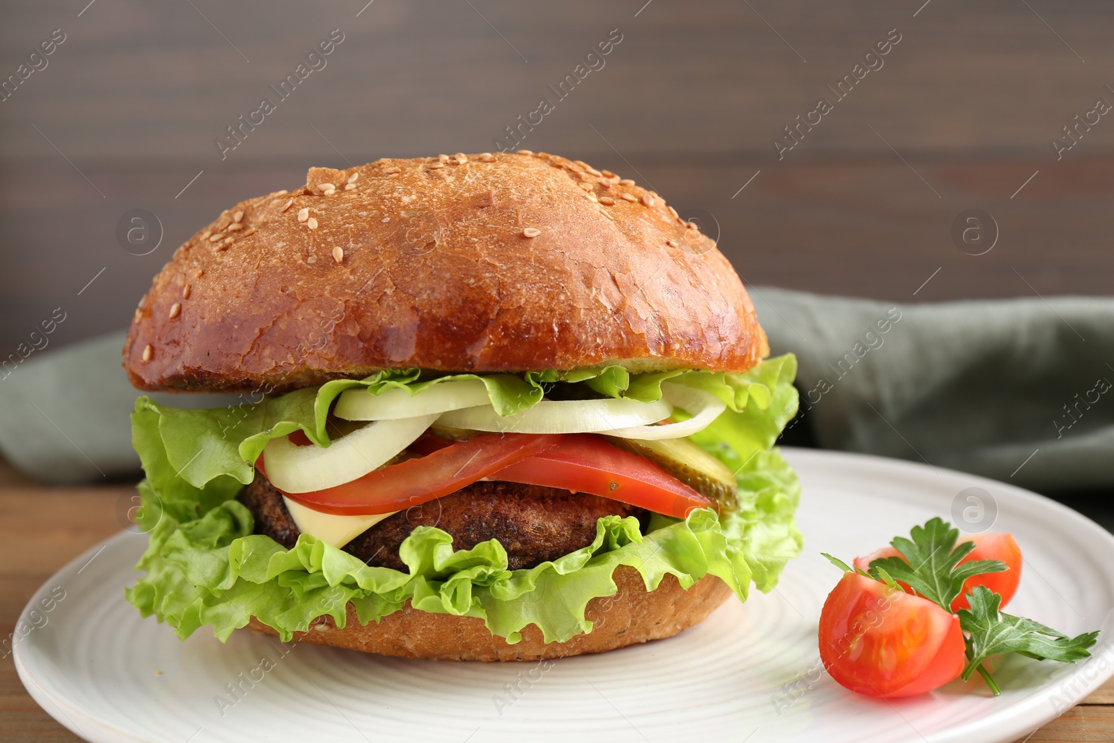 Photo of Delicious vegetarian burger on table, closeup view