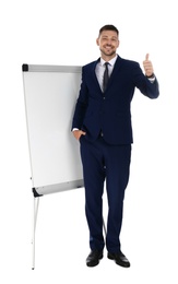 Professional business trainer near flip chart board on white background. Space for text