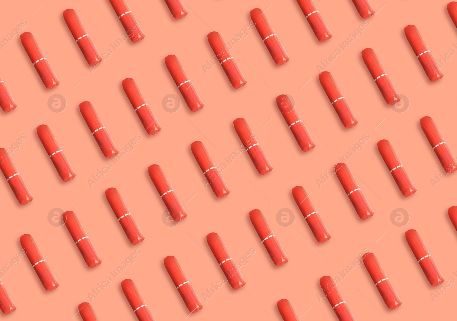 Image of Many tampons on coral background, flat lay 