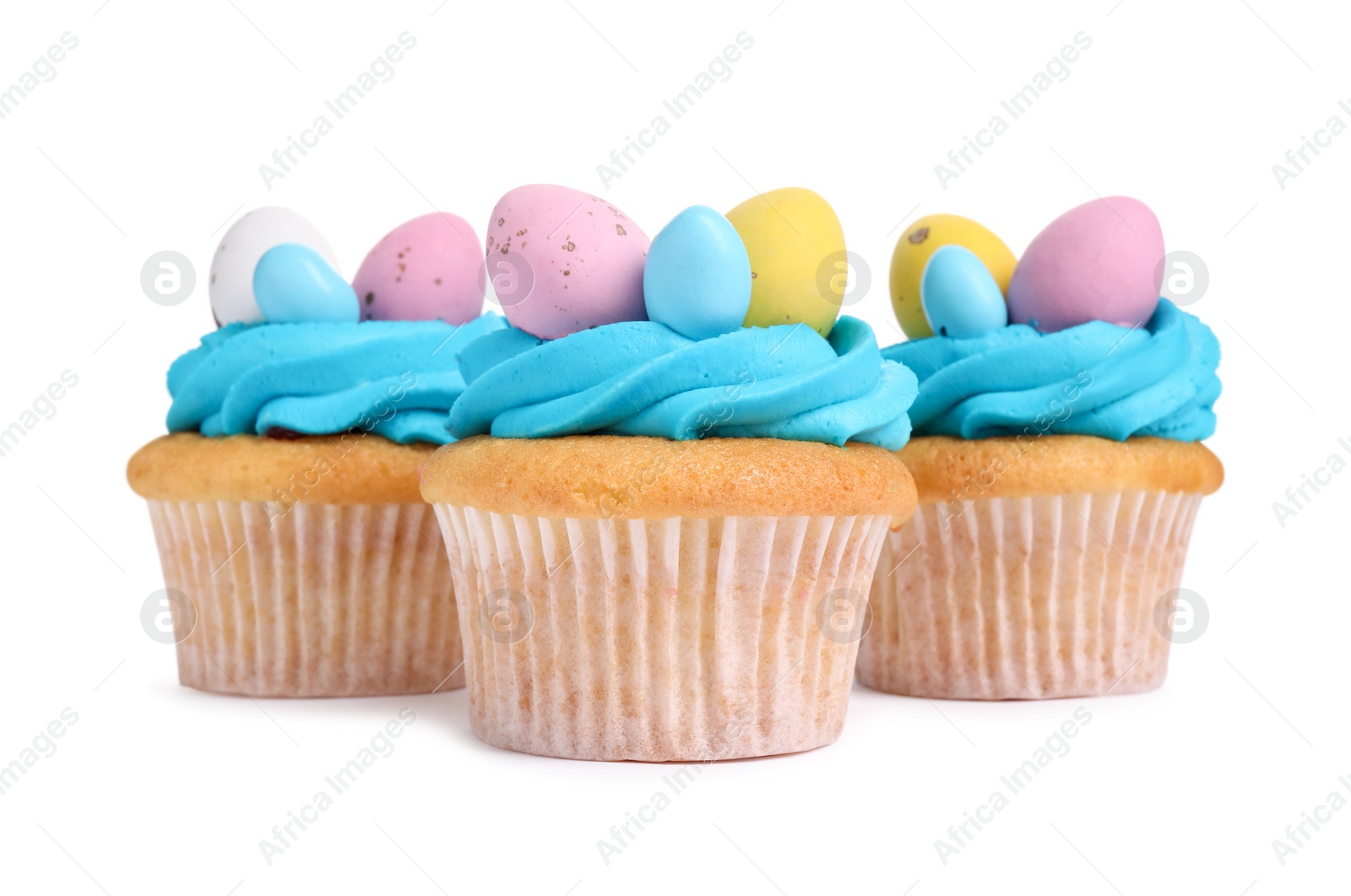 Photo of Tasty decorated Easter cupcakes isolated on white