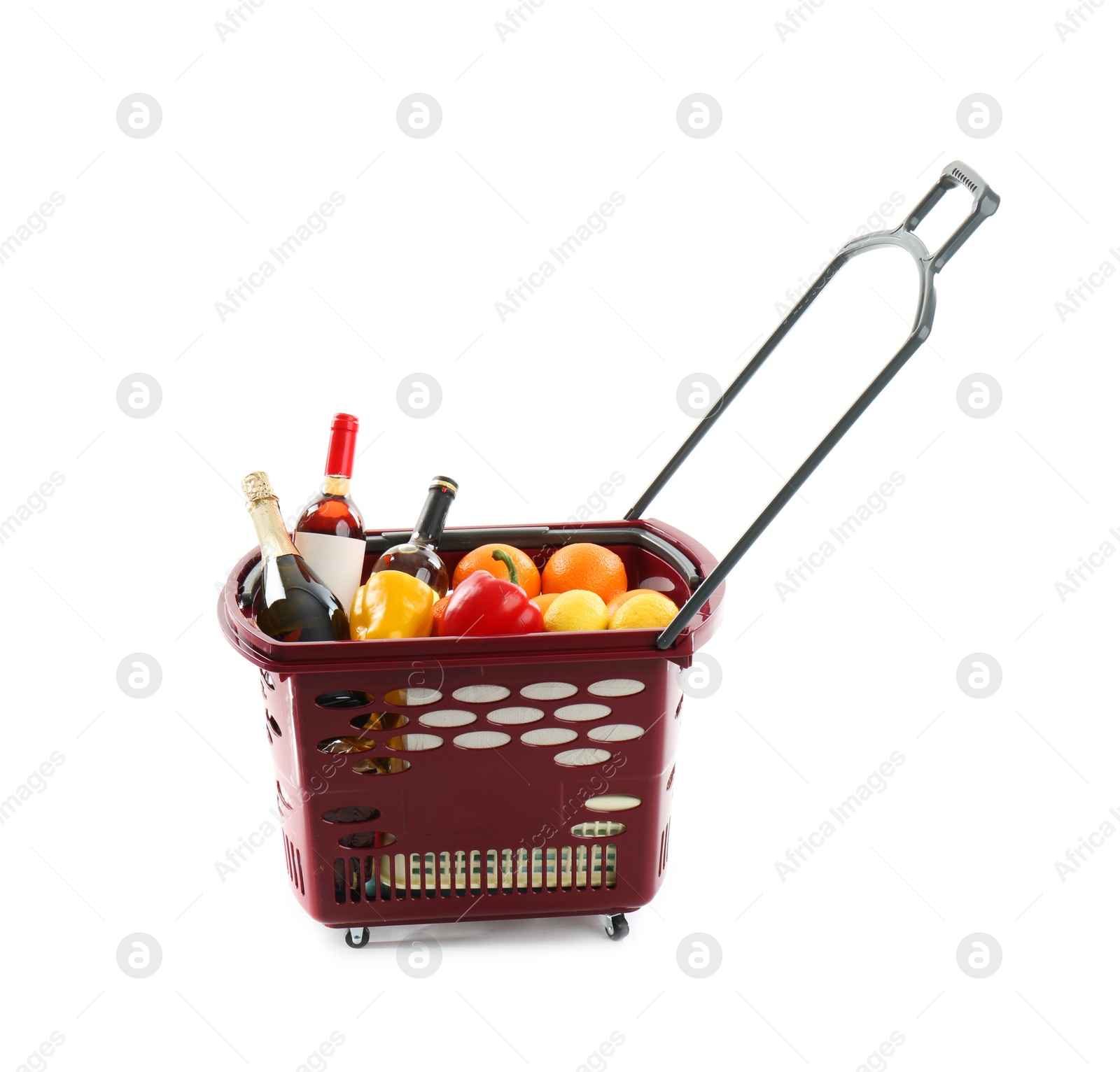 Photo of Shopping basket full of different products isolated on white