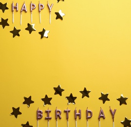 Flat lay composition with birthday candles on color background. Space for text