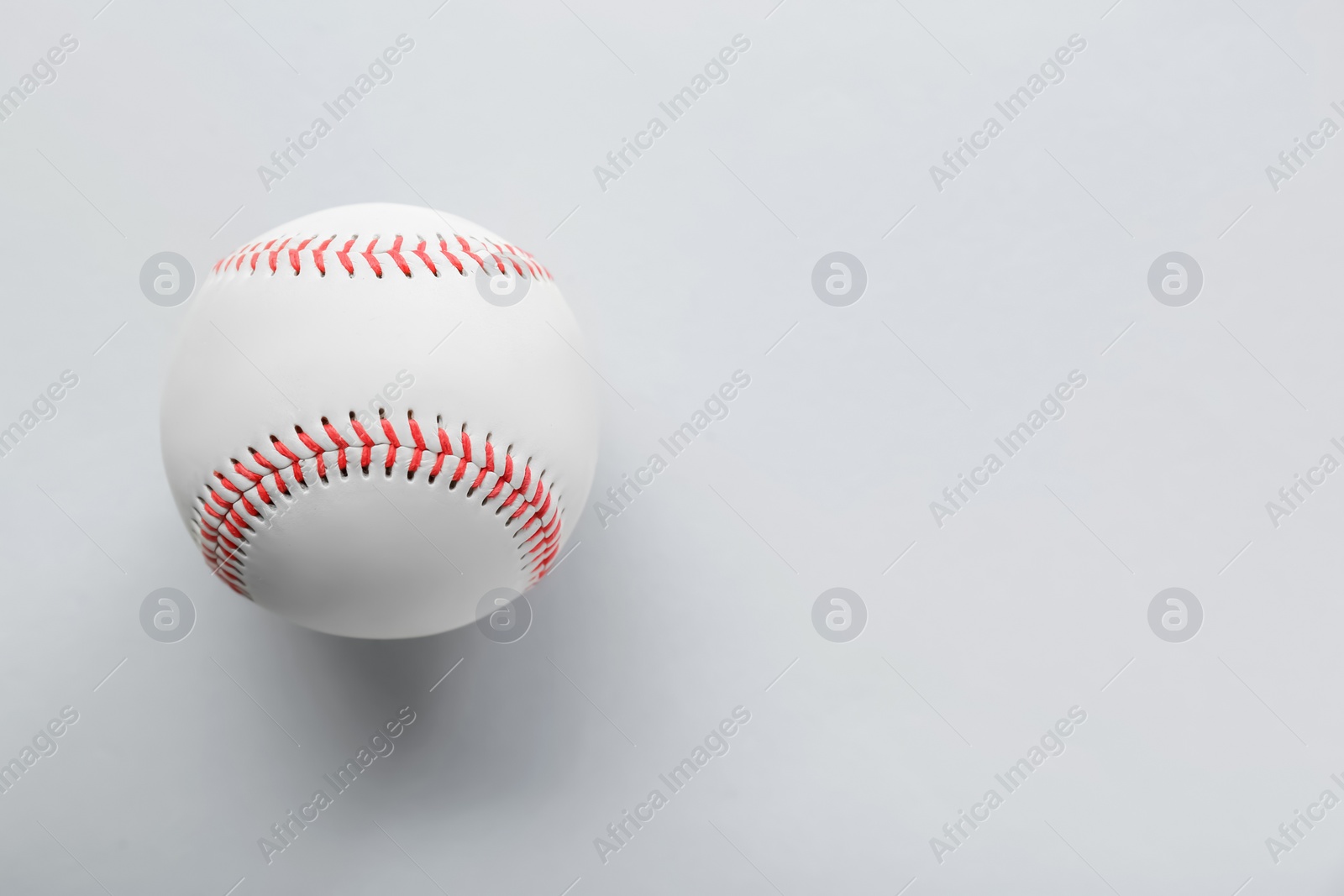 Photo of Baseball ball on white background, top view with space for text. Sports game