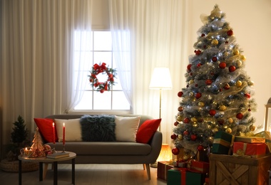 Photo of Beautiful living room interior with decorated Christmas tree