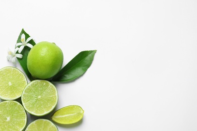 Photo of Citrus fruits, flowers and leaves on white background, top view