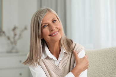 Photo of Portrait of beautiful middle aged woman at home