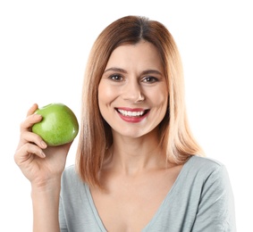 Smiling woman with perfect teeth and green apple on white background