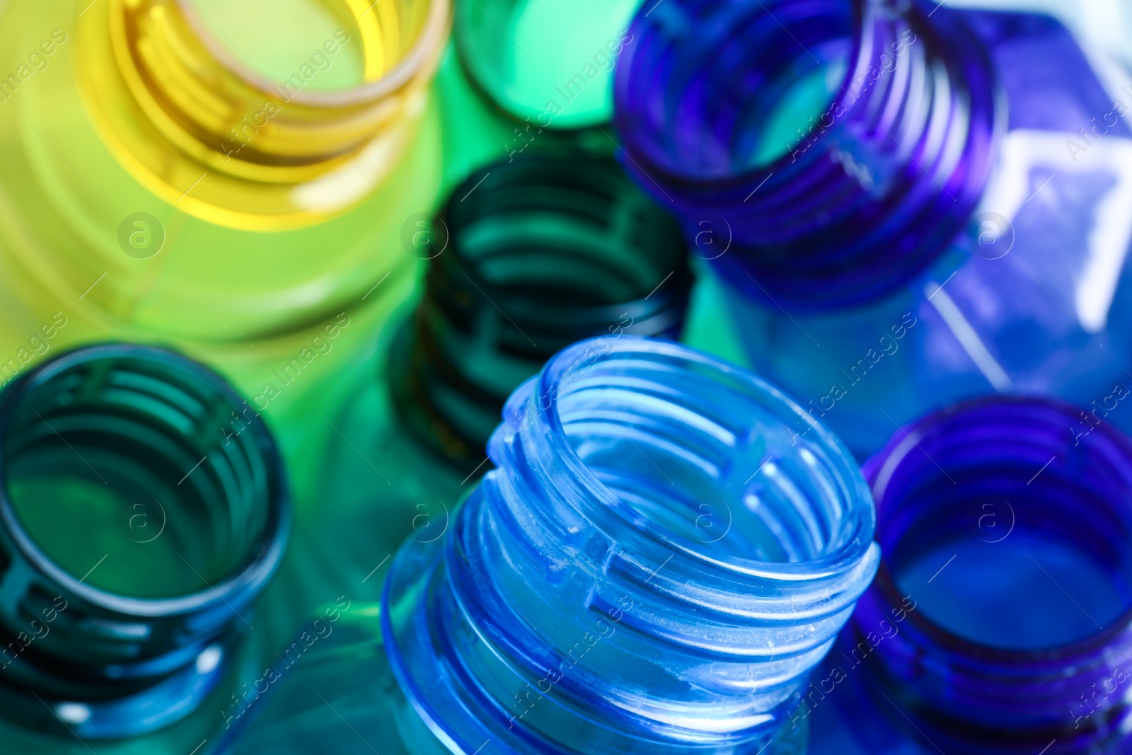 Photo of Used plastic bottles as background, closeup. Recycling problem