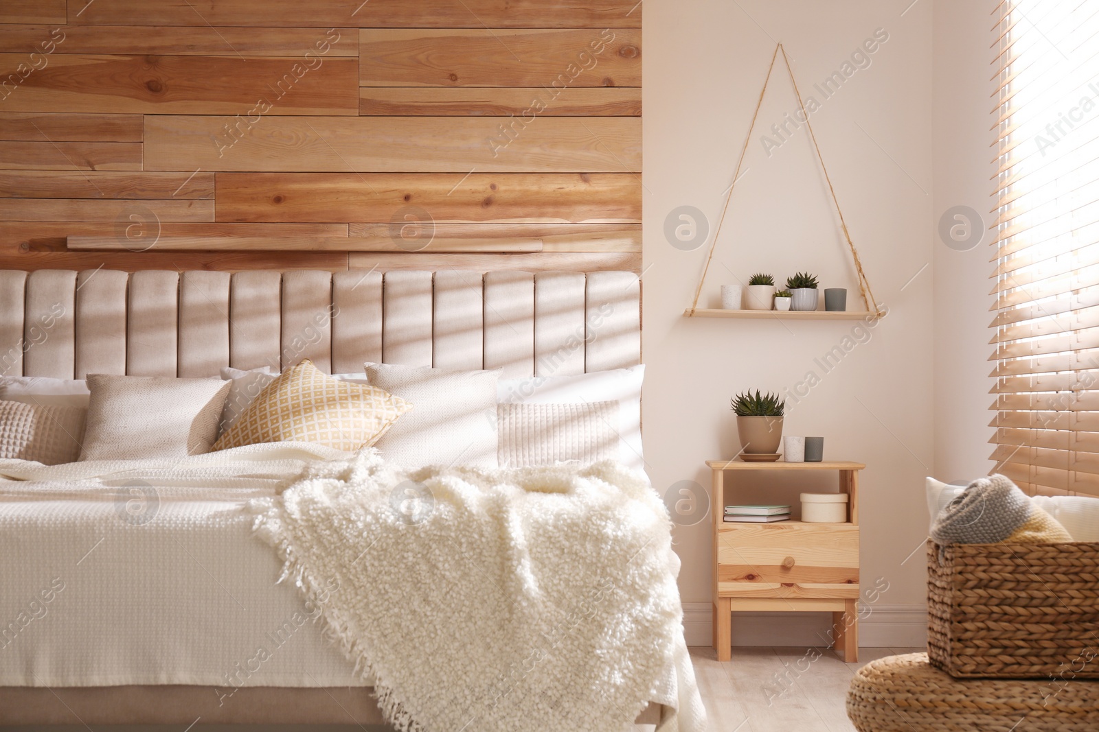 Photo of Comfortable bed with pillows in modern room interior