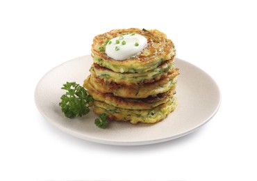 Photo of Delicious zucchini fritters with sour cream isolated on white