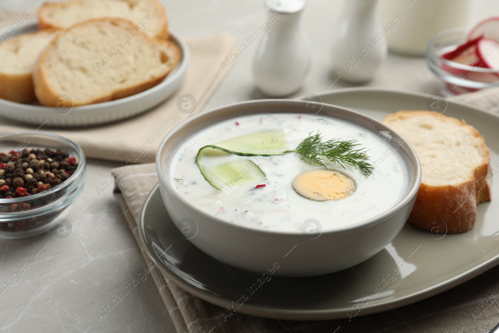 Photo of Delicious cold summer soup on light table