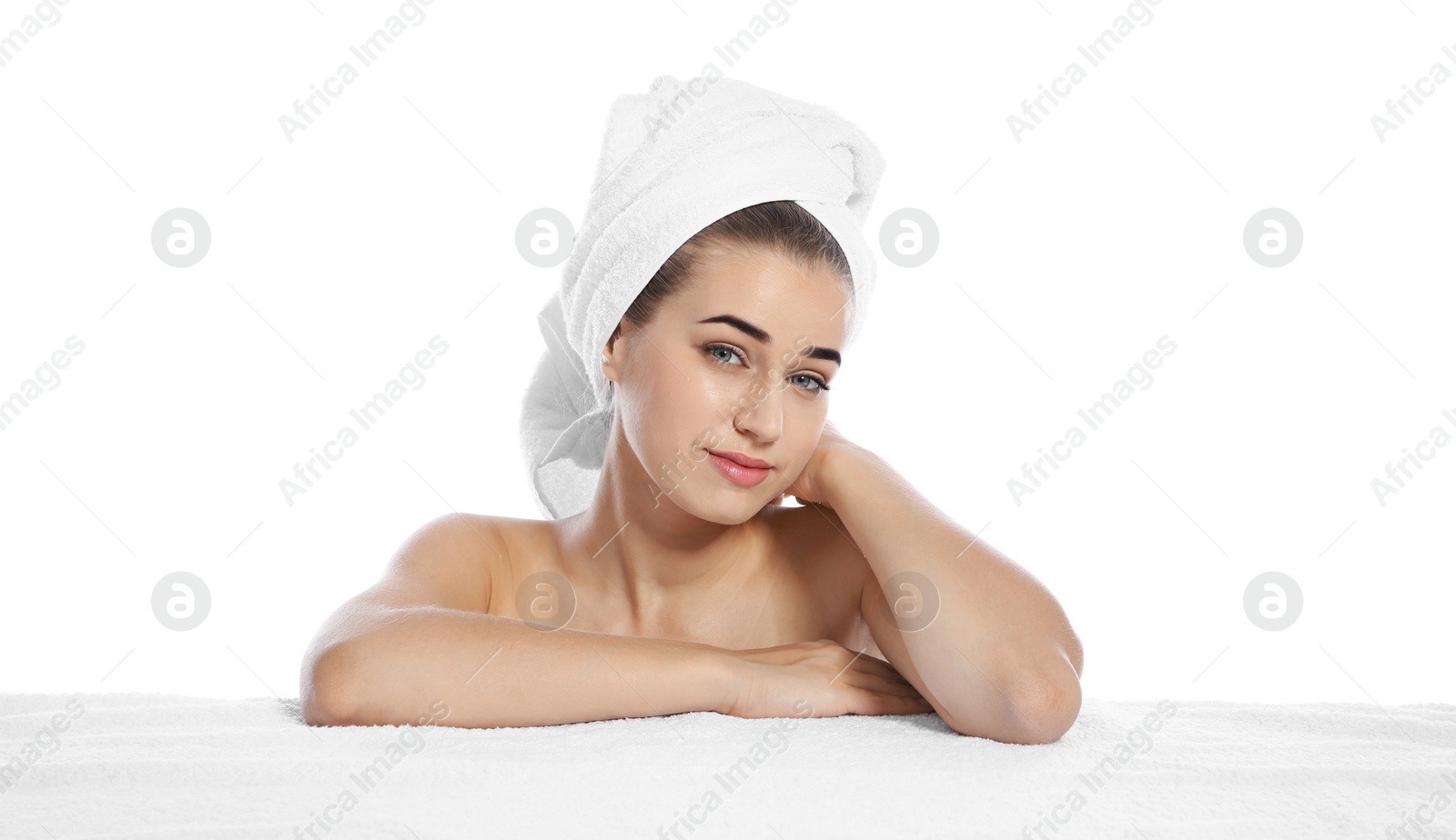 Photo of Portrait of young pretty woman with towel on white background