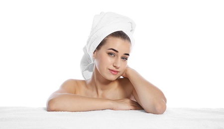 Photo of Portrait of young pretty woman with towel on white background