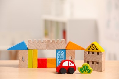 Photo of Set of wooden toys on table indoors, space for text. Children's development