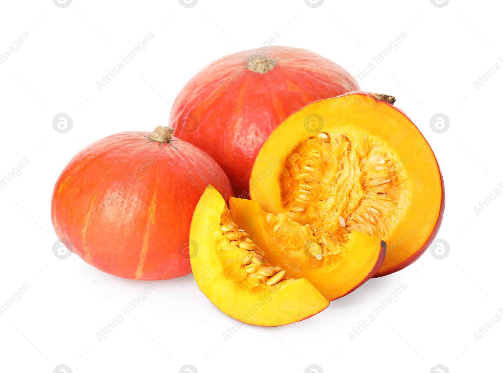 Photo of Many whole and cut ripe pumpkins on white background