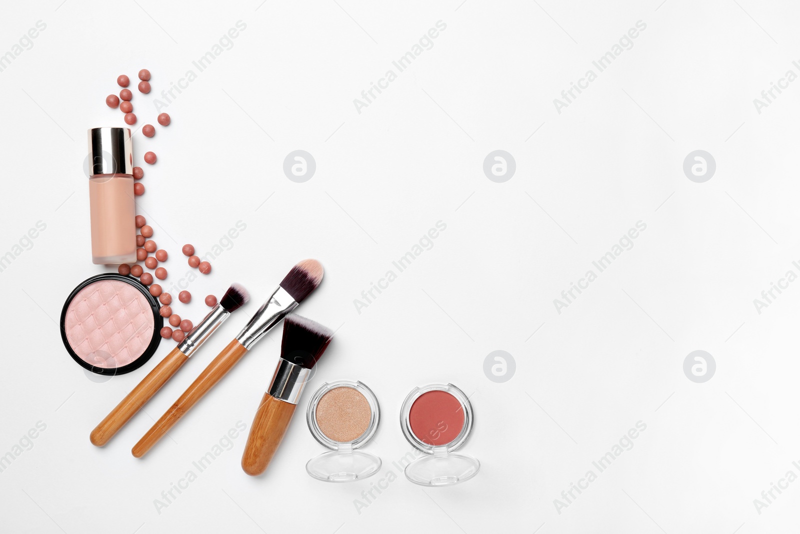 Photo of Decorative makeup products on white background