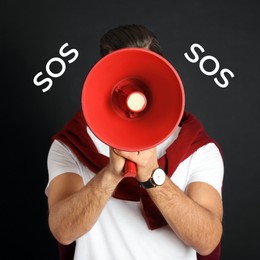 Image of Man with red megaphone and words SOS on black background. Asking for help