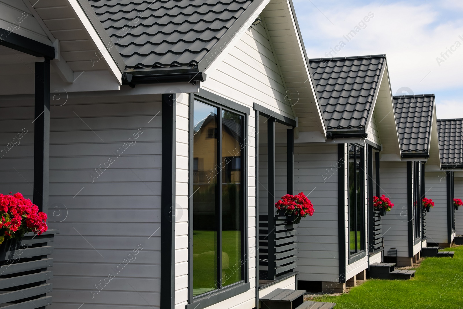 Photo of Exterior of beautiful modern white houses outdoors