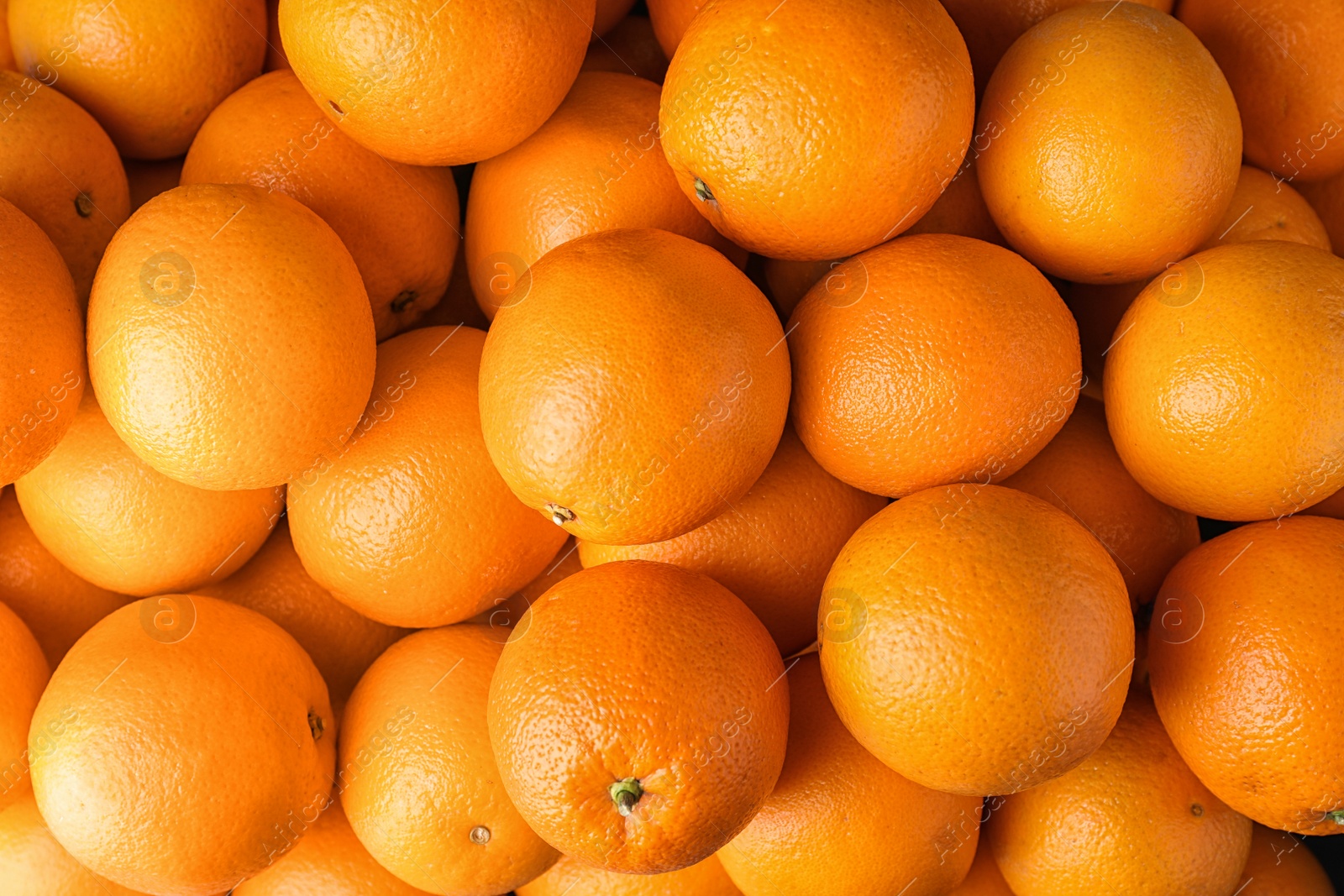 Photo of Pile of fresh ripe oranges as background, top view