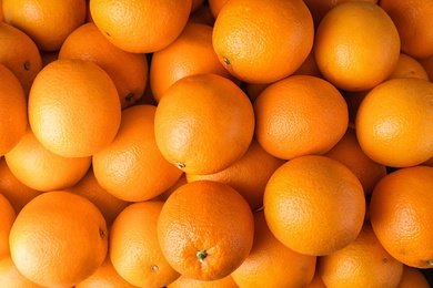 Photo of Pile of fresh ripe oranges as background, top view