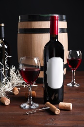 Photo of Composition with delicious red wine on wooden table