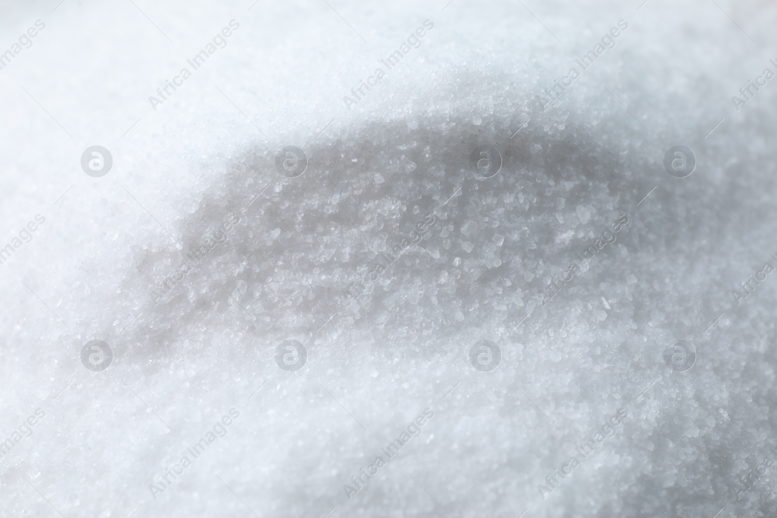 Photo of Organic white sea salt as background, closeup