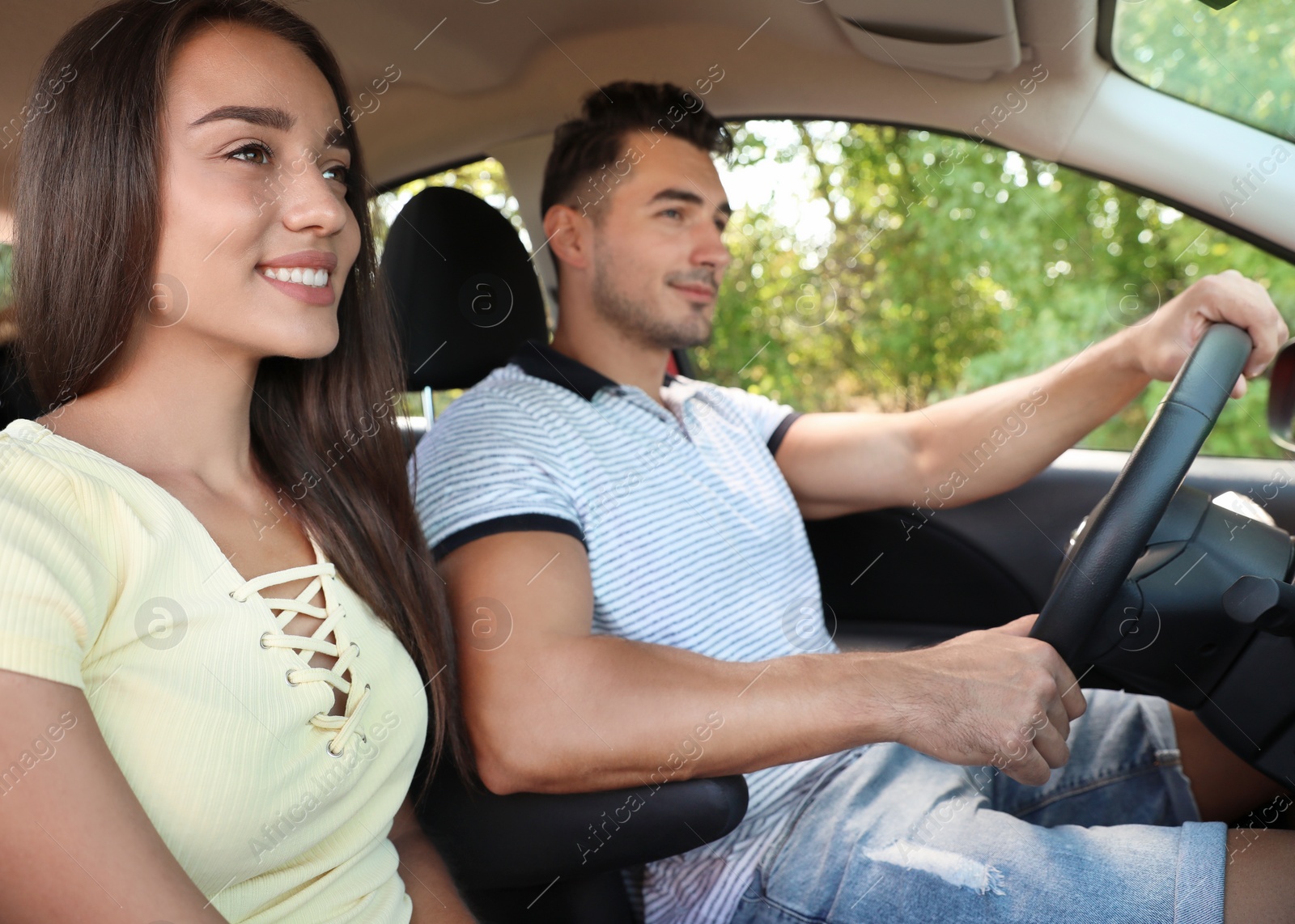 Photo of Happy young couple in car on road trip