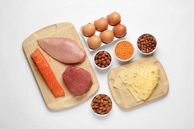 Photo of Different fresh products on white background, top view. Sources of essential amino acids