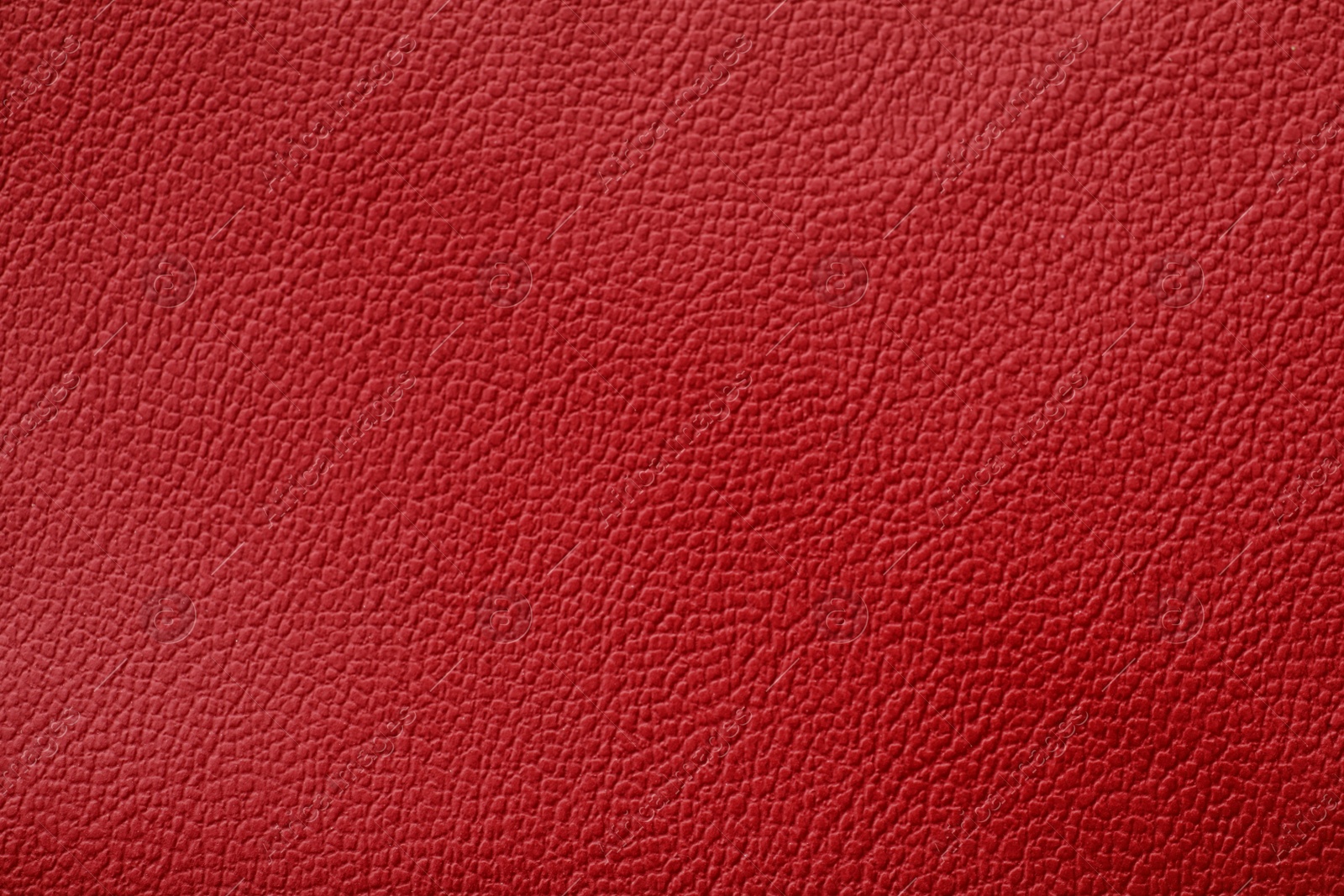 Photo of Texture of red leather as background, closeup