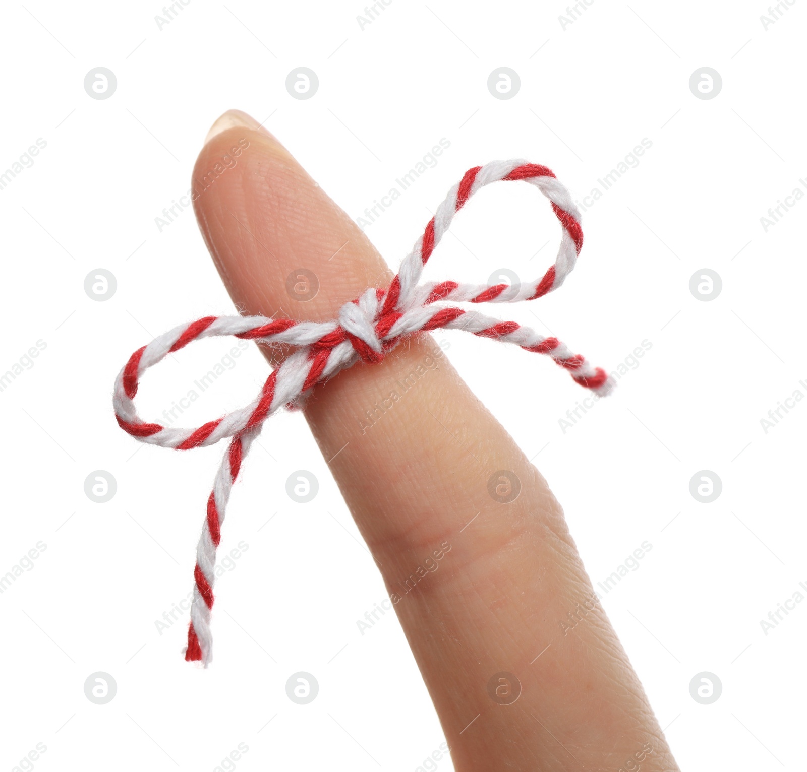 Photo of Woman showing index finger with tied bow as reminder on white background, closeup