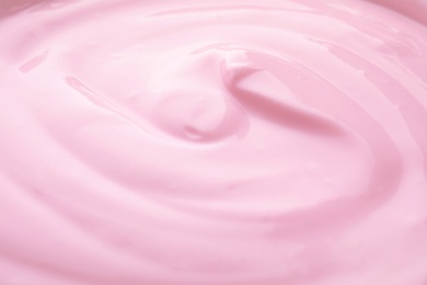 Delicious creamy yogurt as background, closeup view