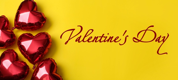 Image of Happy Valentine's Day. Red heart shaped balloons on yellow background, flat lay 