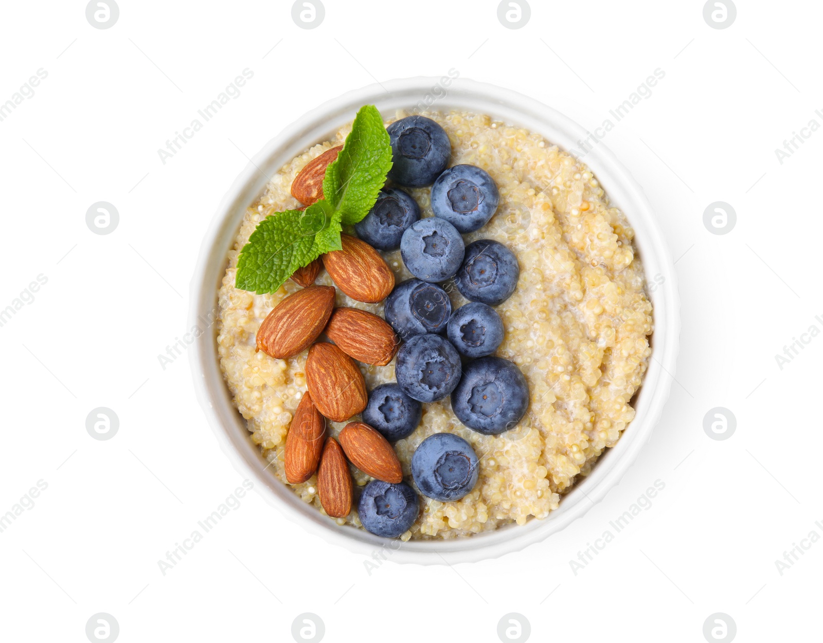 Photo of Bowl of delicious cooked quinoa with almonds and blueberries isolated on white, top view