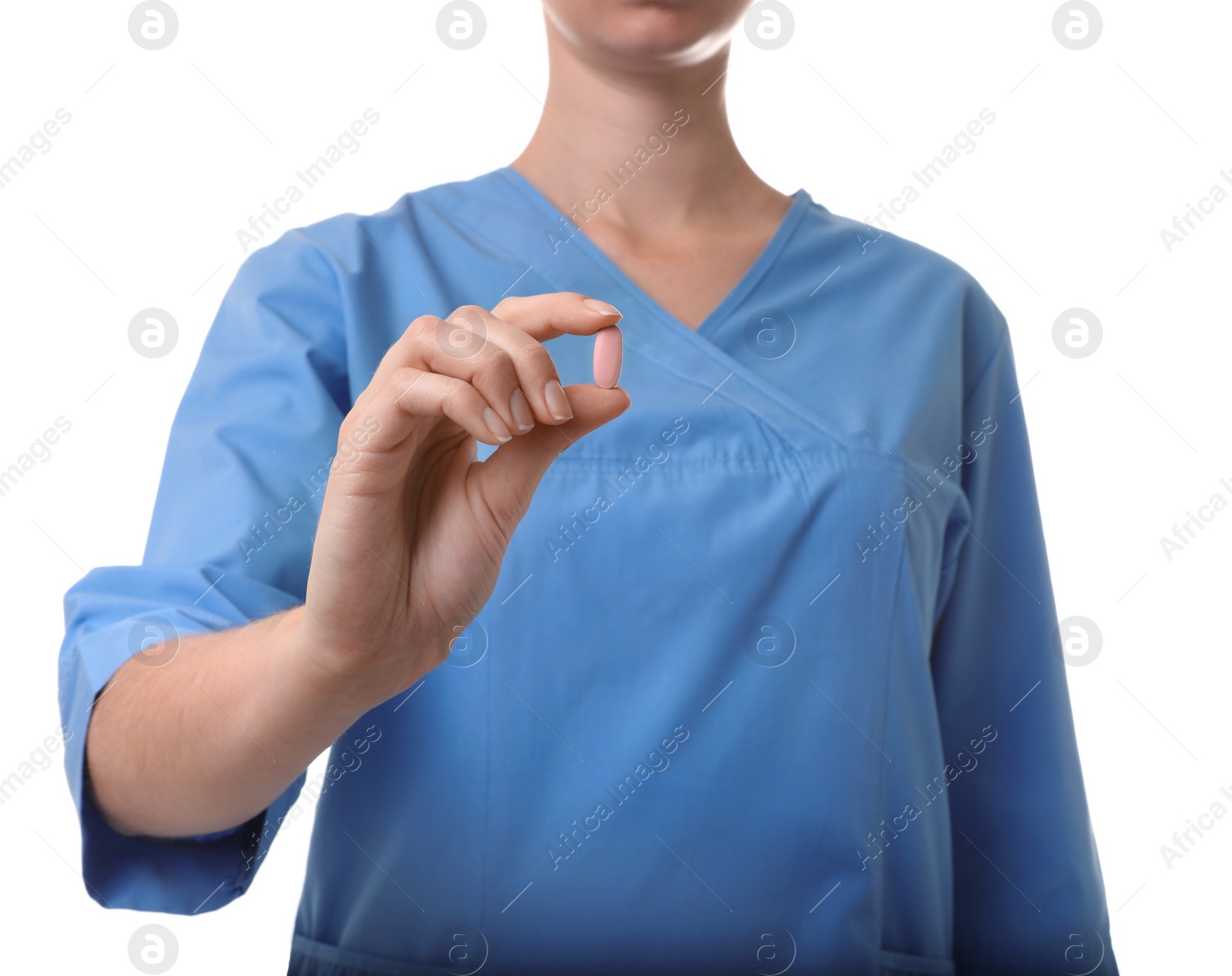 Photo of Female doctor holding pill on white background, closeup. Medical object