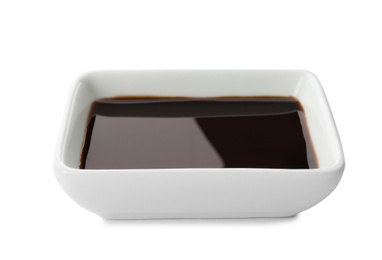 Photo of Dish of soy sauce on white background