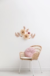 Photo of Stylish room interior with floral decor and armchair