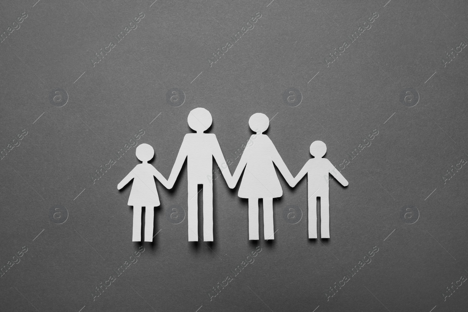 Photo of Paper family figures on grey background, top view. Insurance concept