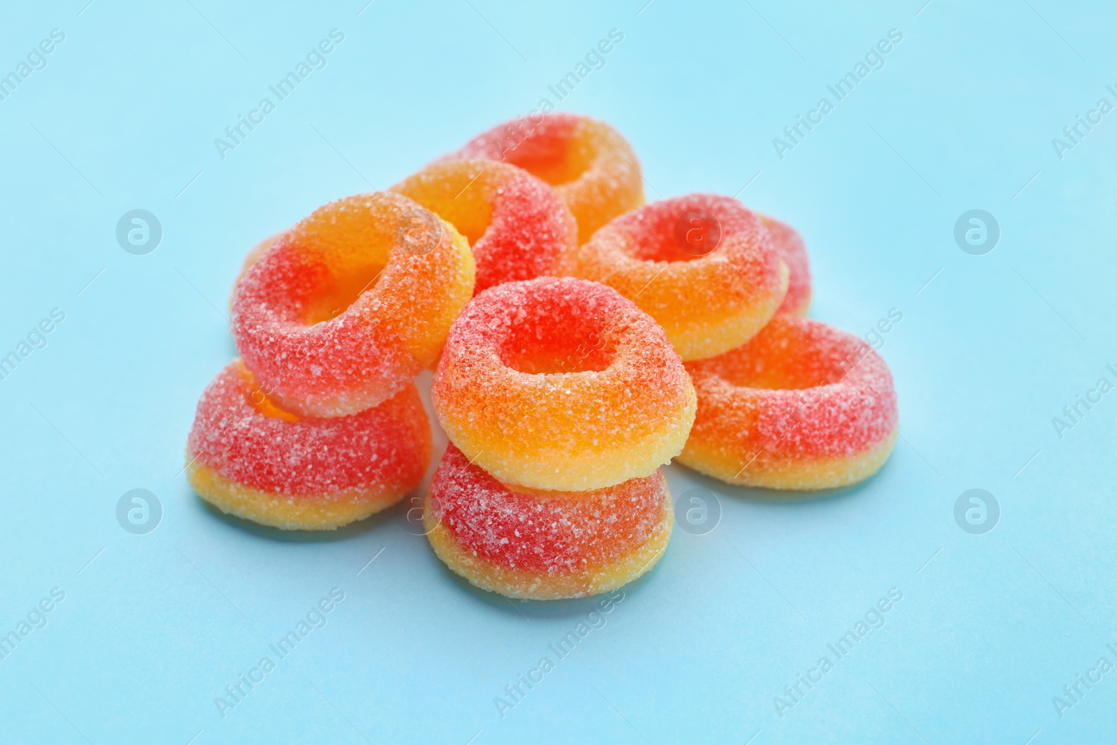 Photo of Pile of tasty jelly candies on color background