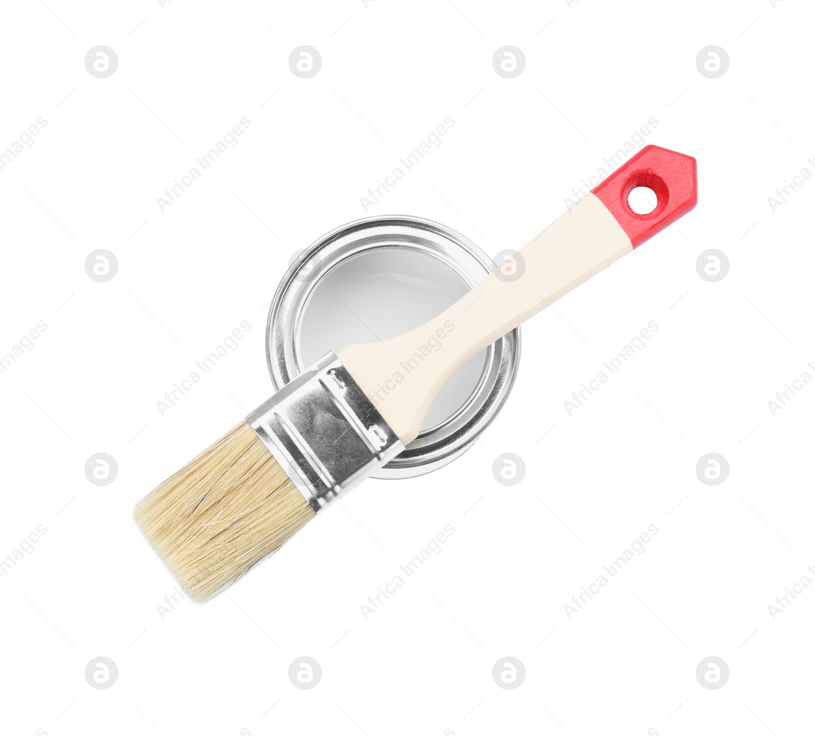 Photo of Can of paint with brush isolated on white, top view