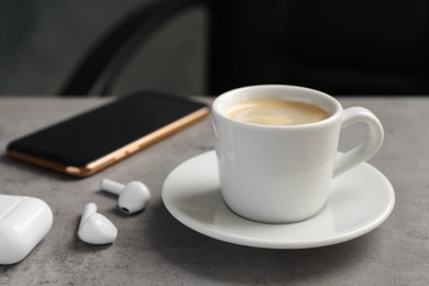 Cup of espresso on grey table in office. Coffee Break