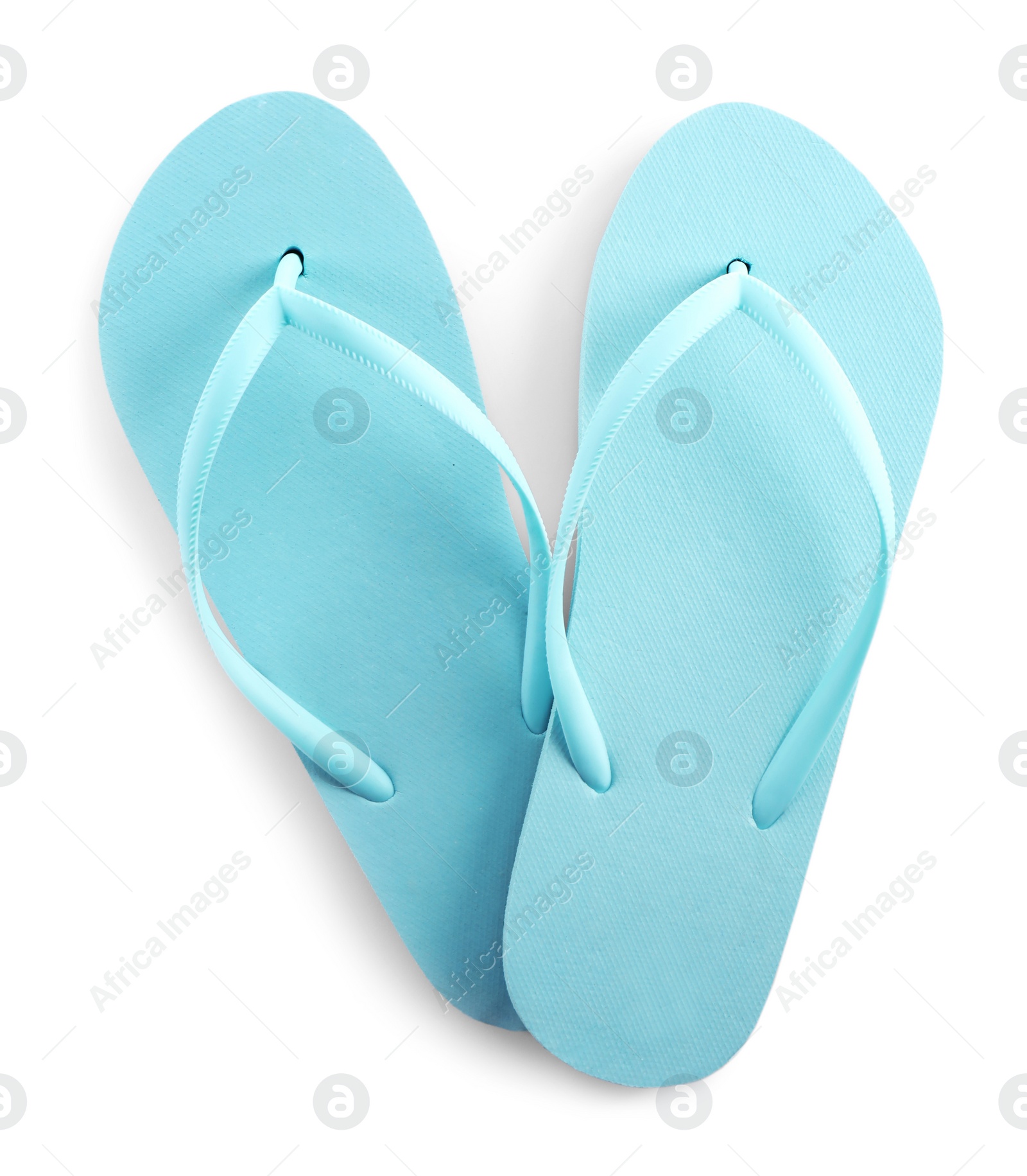 Photo of Light blue flip flops isolated on white, top view. Beach accessory