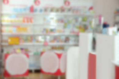 Image of Blurred view of modern drugstore with pharmaceuticals